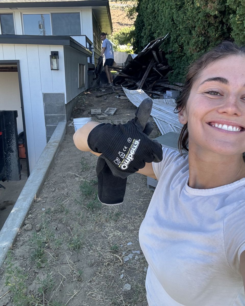 Kaylie hauling away debris on one of our jobs